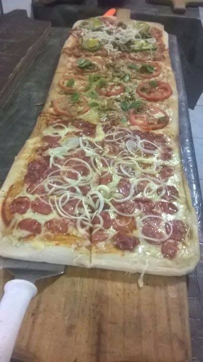 No delivery da Pizzaria Papizza o refrigerante é por conta da casa