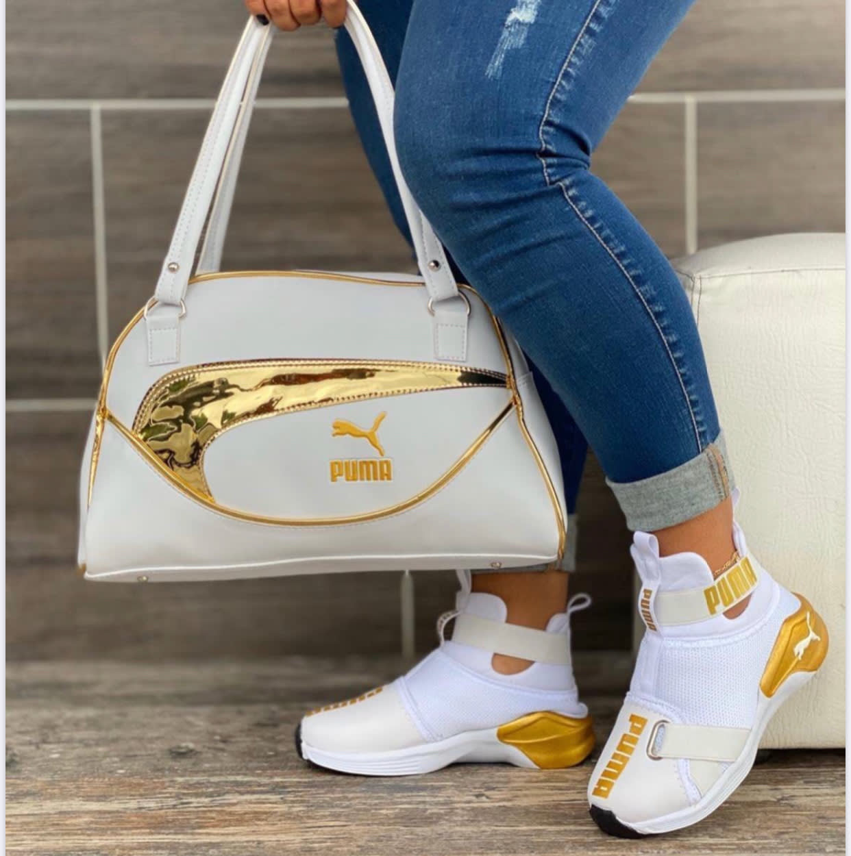 white and gold puma bag