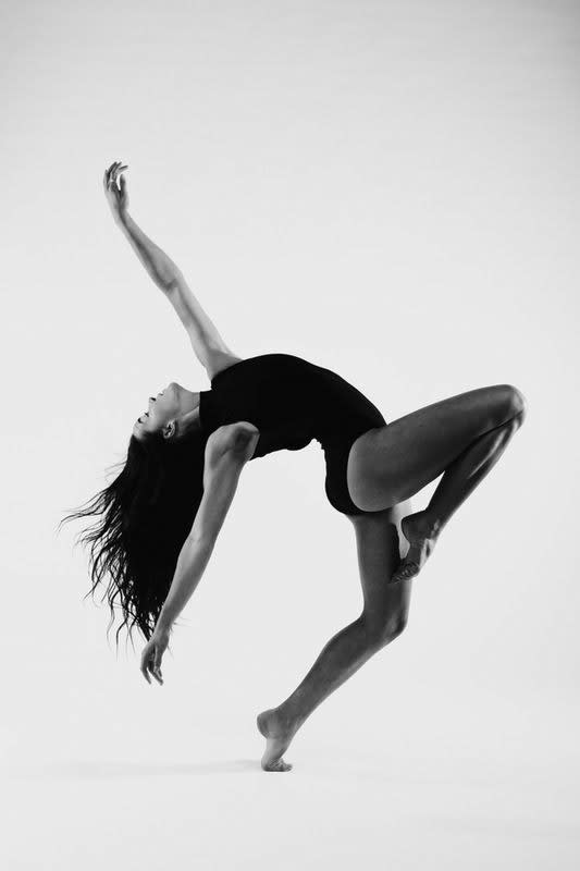 A woman standing on one leg in a pose photo – Free Contemporary dance Image  on Unsplash