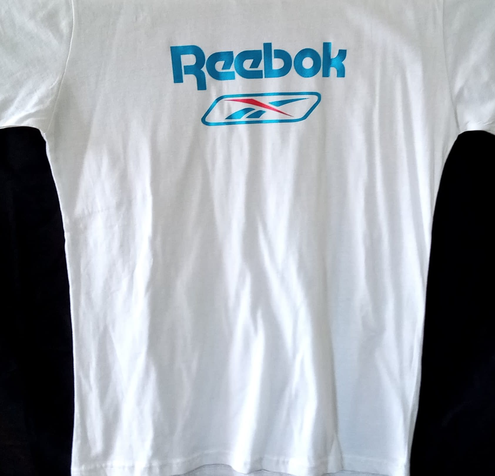 red white and blue reebok shirt