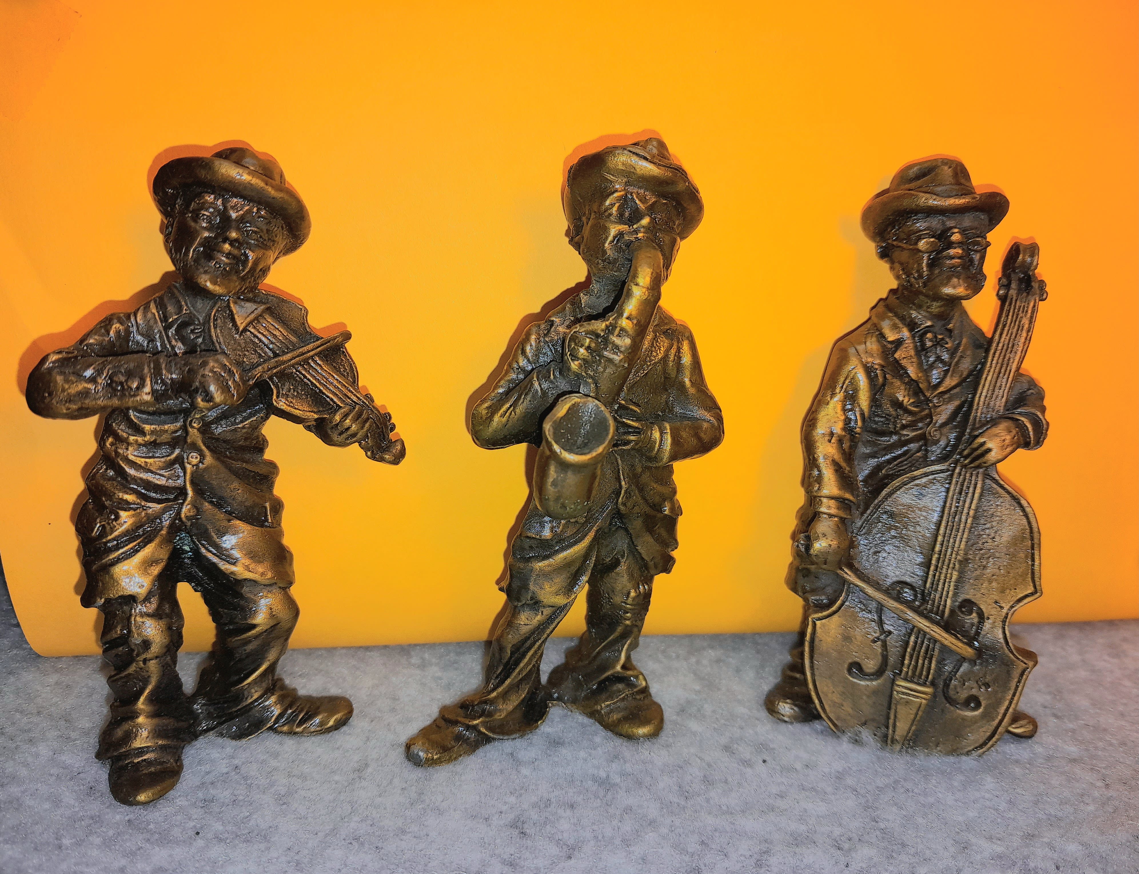 Antiqued brass figures of a band of monkeys