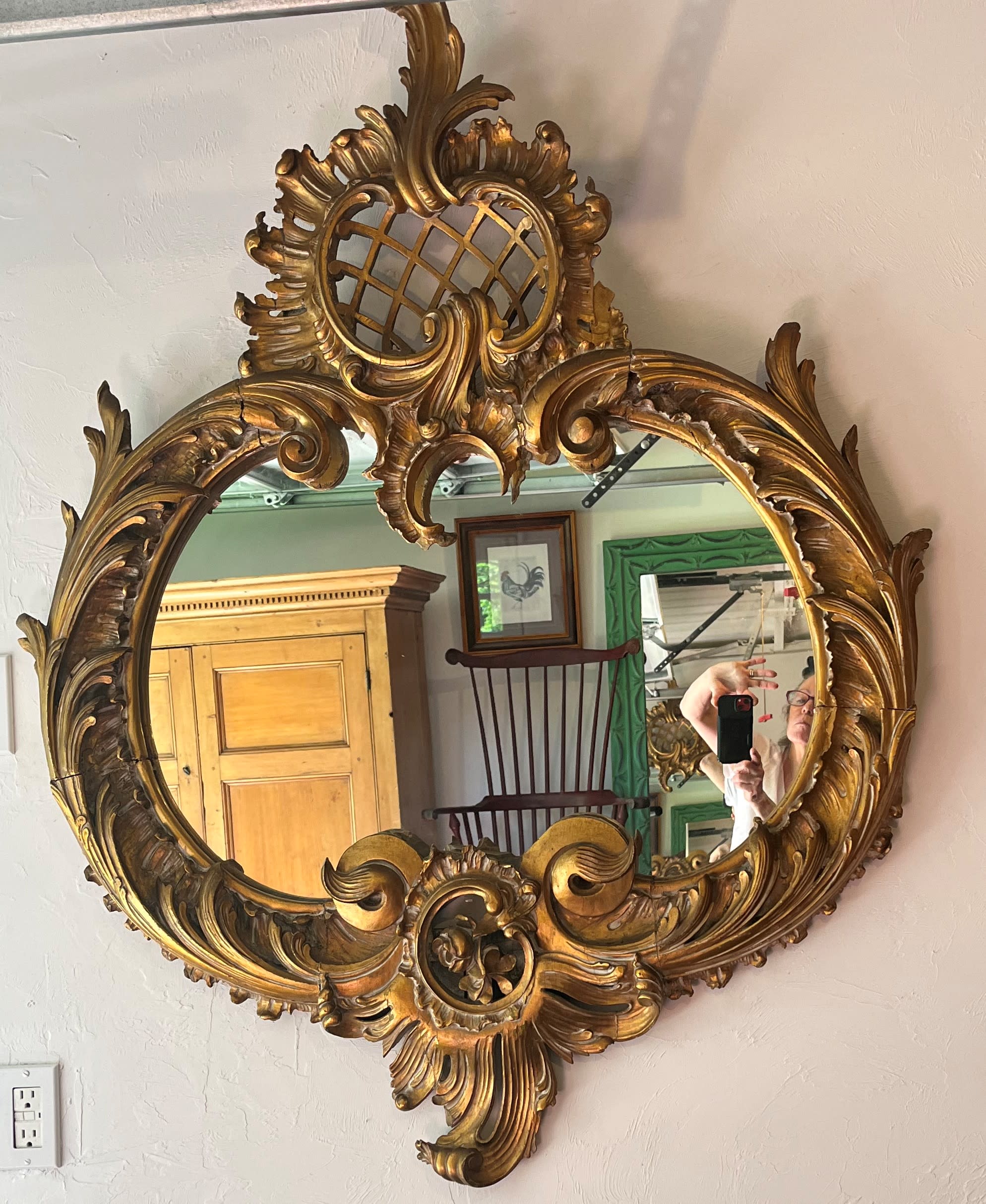 Large decorative antique French oval mirror