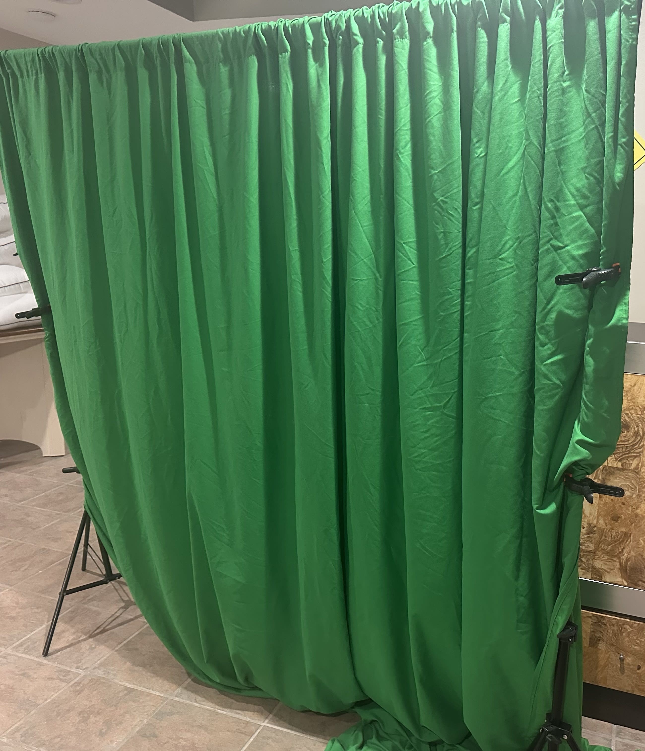 Backdrop stand with green cloth, if needed