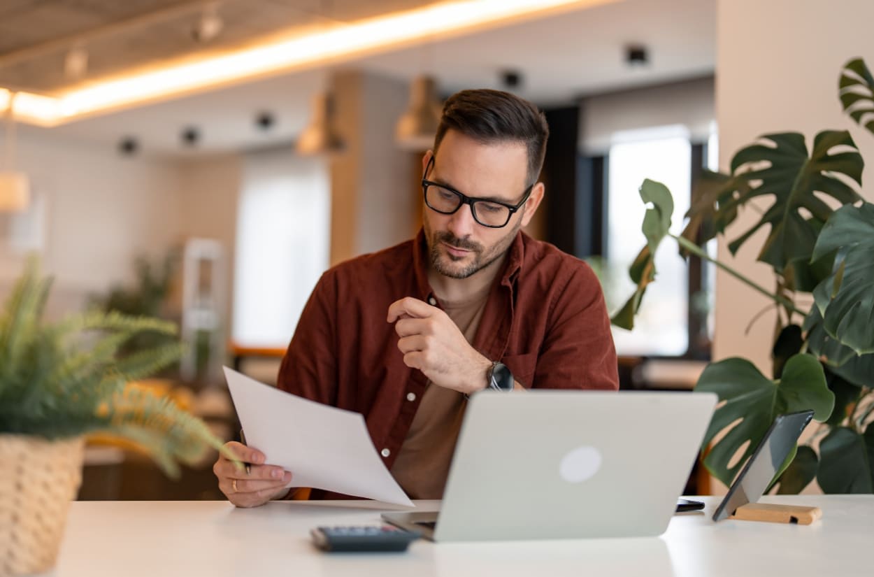 Business owner reviewing clear financial reports and profit information