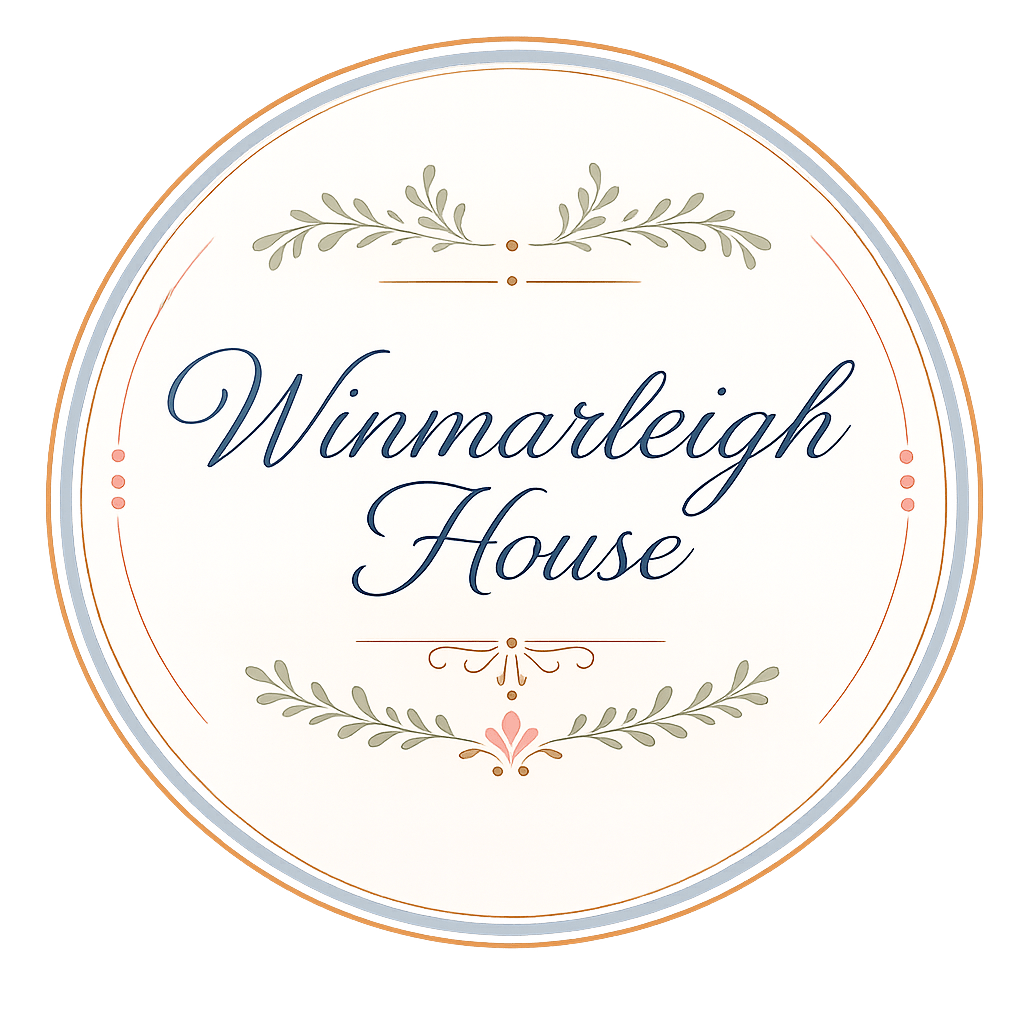 Circular logo for Winmarleigh House with elegant script and decorative flourishes.